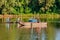 Danube island Å odroÅ¡ near Novi Sad, Serbia. Fishermans sitting in boat and holding fishing r